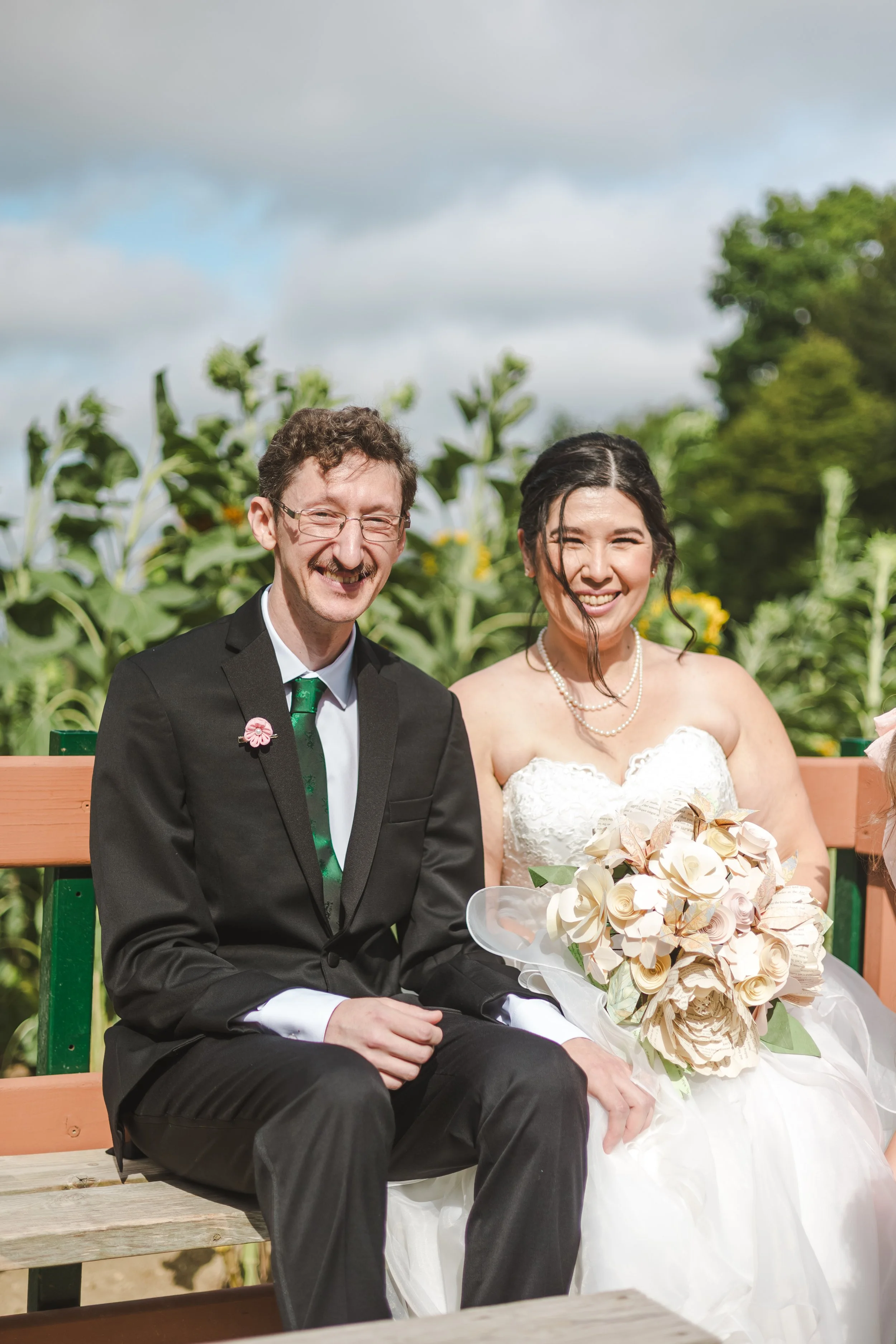 couple-wedding-photo-on-a-bench-fedora-media.jpg