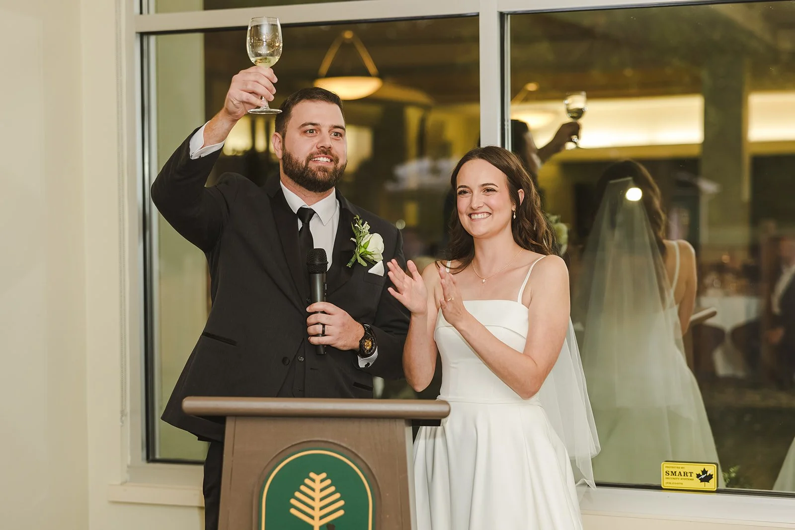 Groom raising a glass during wedding speech  Century Pines  Fedora Media.jpg