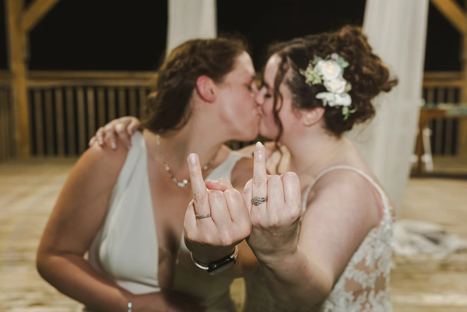 Two brides kiss while holding up their ring fingers  Cambridge, ON  Newfoundland Club  Fedora Media.jpg