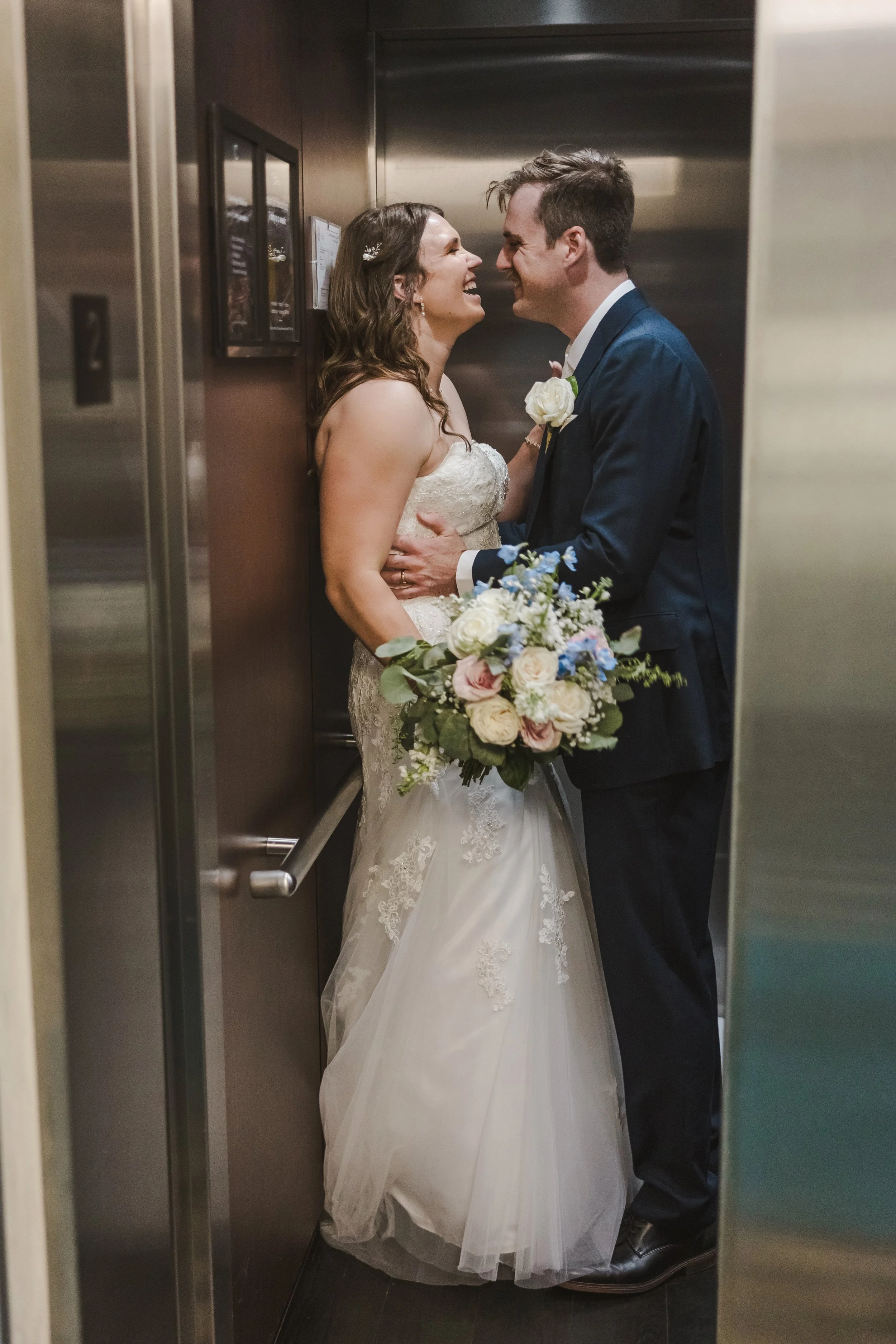 couple-in-elevator-fedora-media.jpg