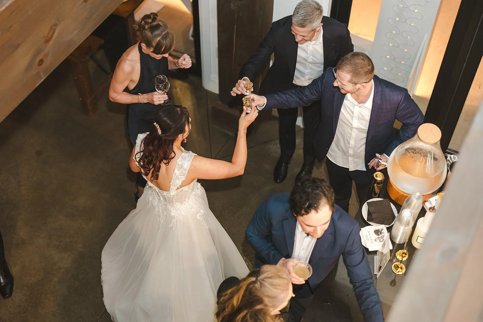 Bride drinking shots with guests  Erin Estates  Fedora Media.jpg