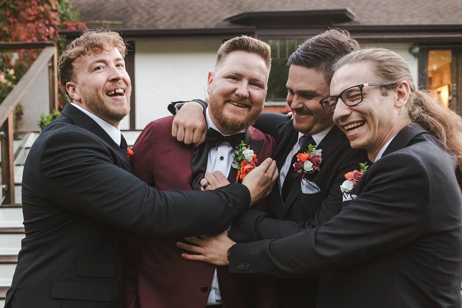 Groomsmen hugging groom  Erin Estates  Fedora Media.jpg