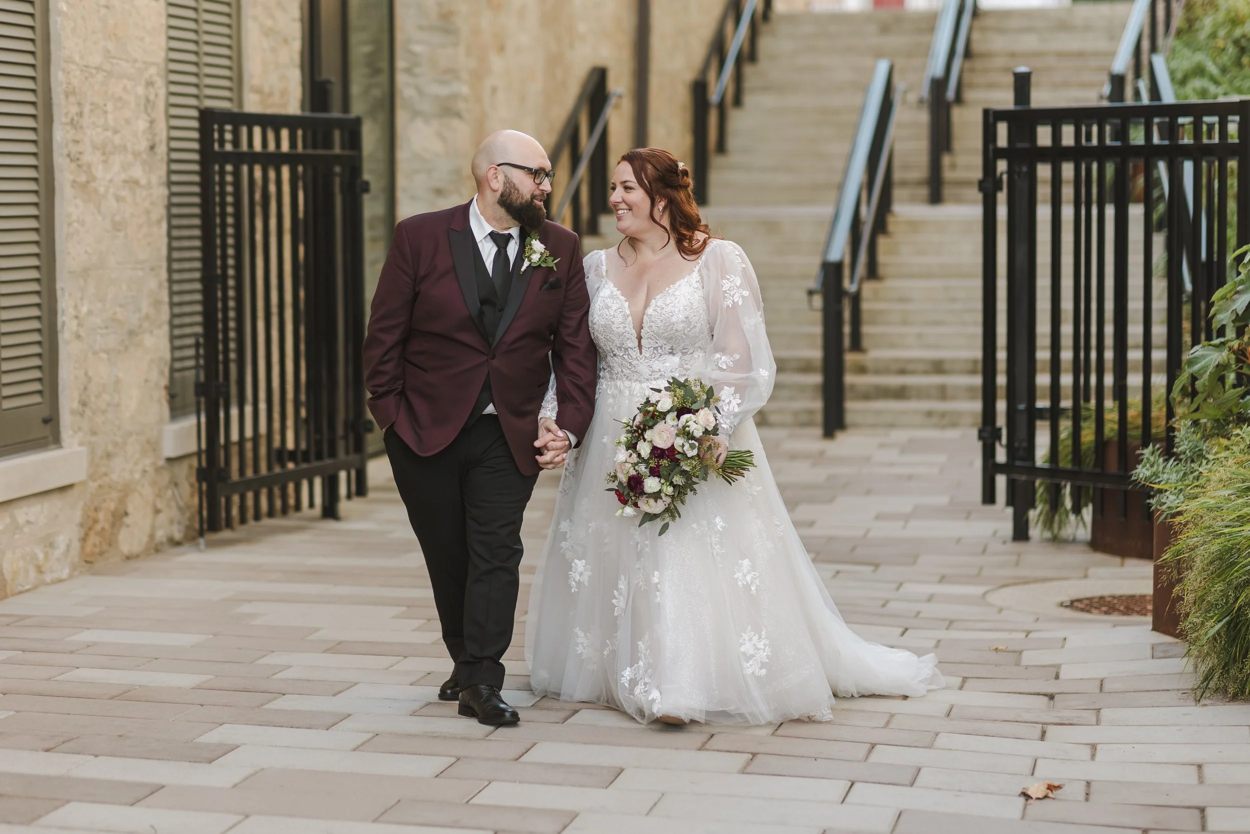 bride-and-groom-walking-holding-hands-fedora-media.jpg