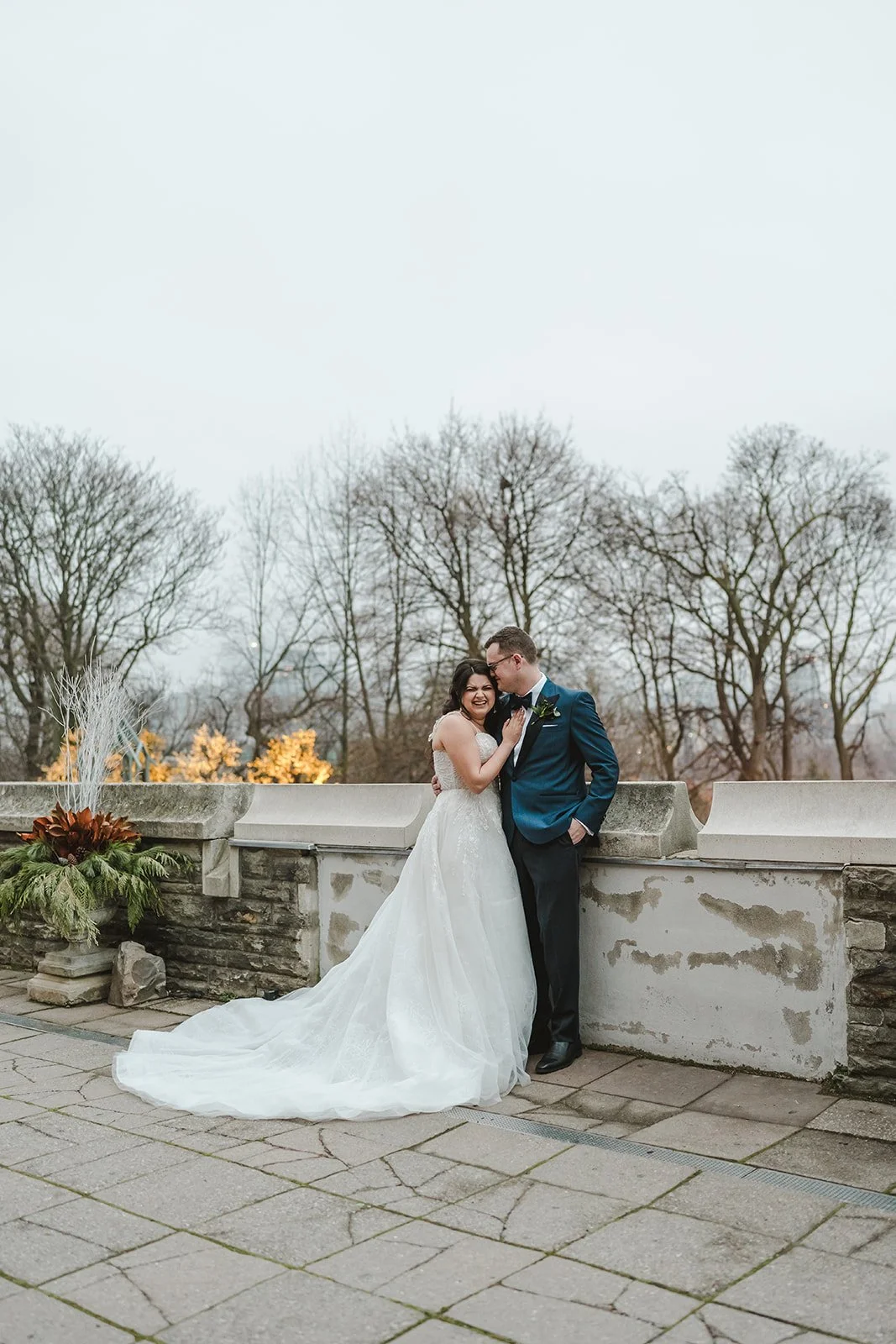 bride-and-groom-posing-outdoors-fedora-media.jpg