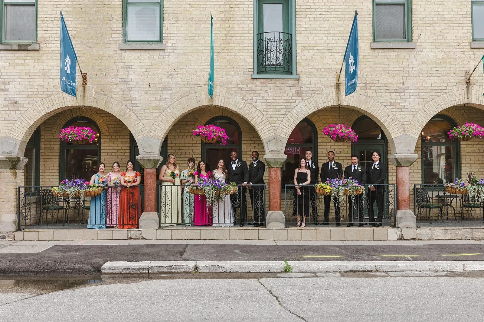 Bride and groom with wedding party in front entrance  River's Edge  Arlington Hotel  Paris, ON  Fedora Media.jpg