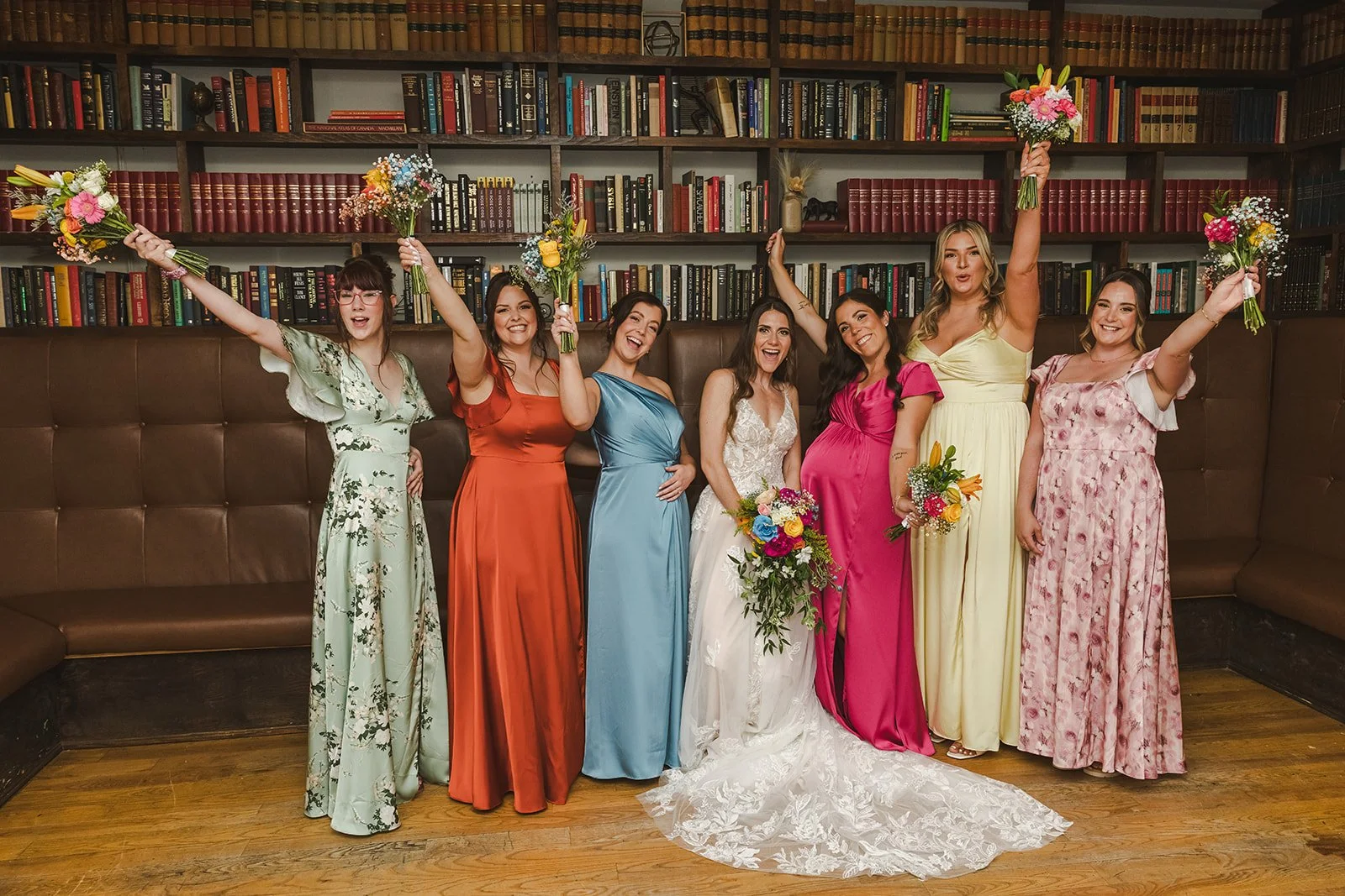 Bride with bridesmaids in library  River's Edge  Arlington Hotel  Paris, ON  Fedora Media.jpg