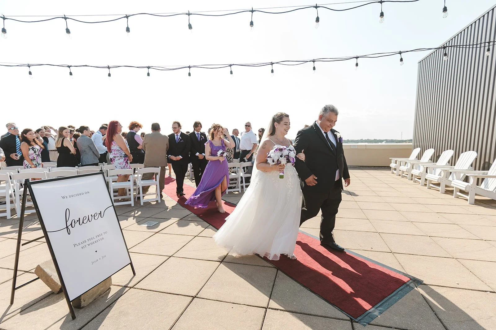 Bride and groom exiting wedding ceremony together  Hamilton, ON  Carmen's Hotel  Fedora Media.jpg