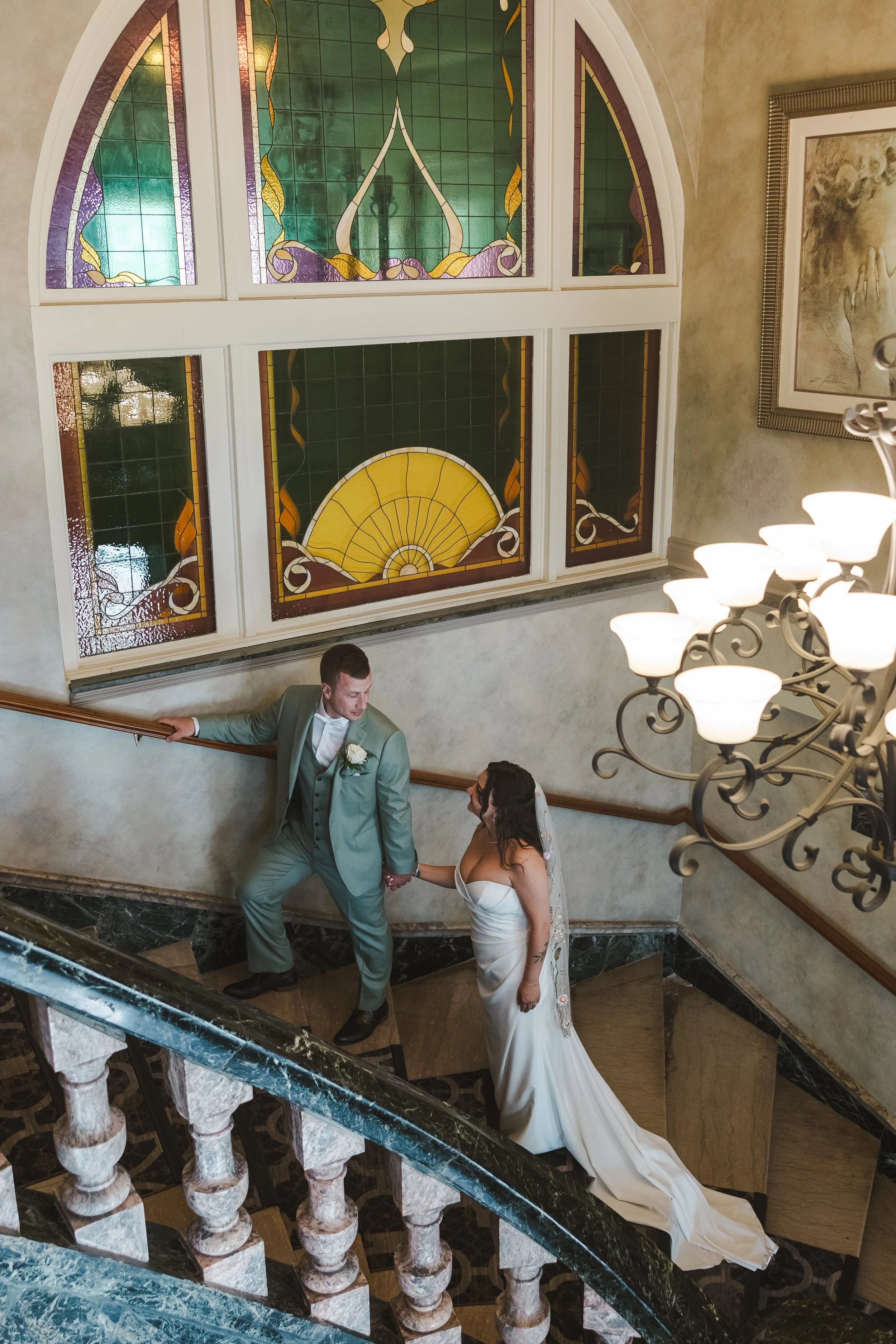 bride-groom-walking-up-stairs-fedora-media.jpg