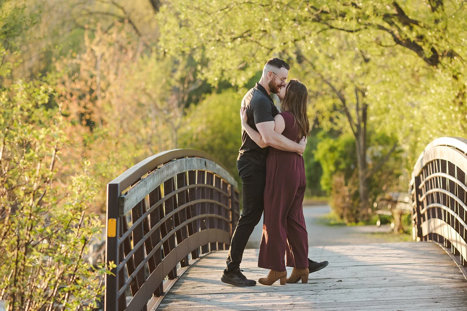 Couple embracing on bridge  Ontario Engagement  Fedora Media.jpg