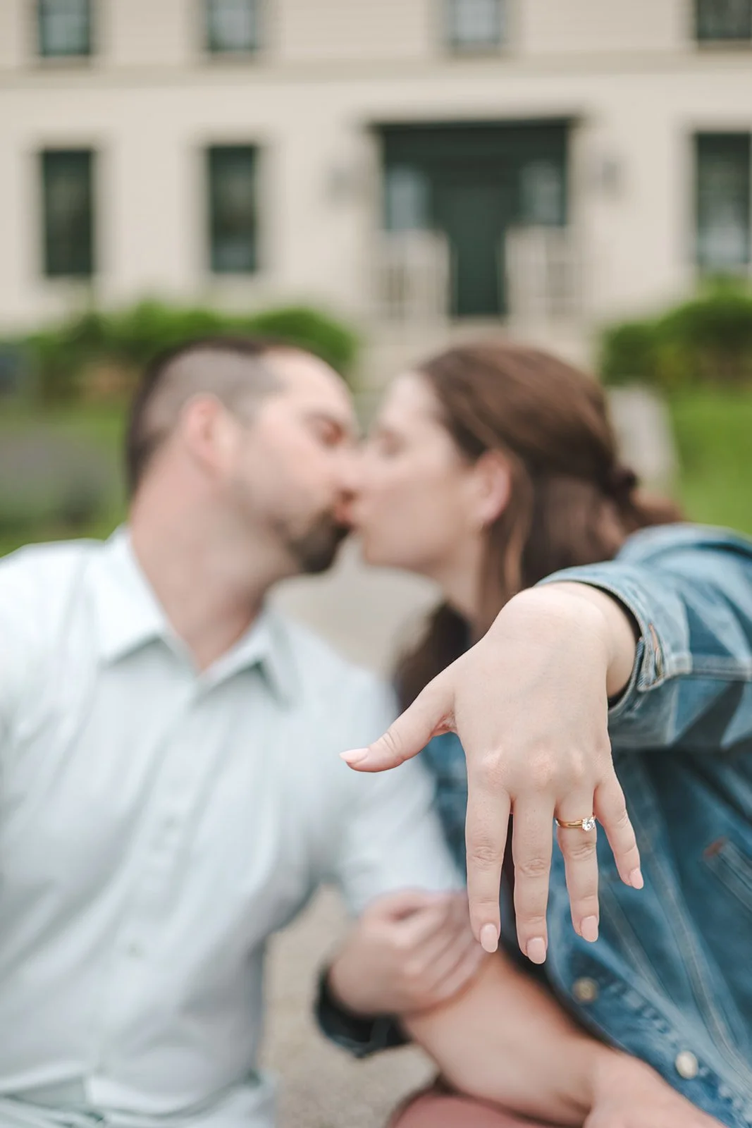Couple kiss while showing off engagement ring  Ontario Engagement  Fedora Media.jpg