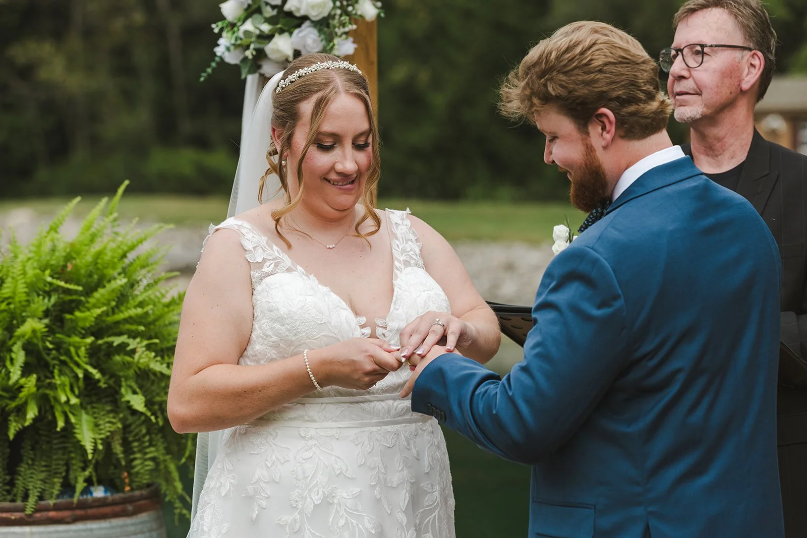 Bride and groom exchange rings  CJ Country events  Guelph, ON  Fedora Media.jpg