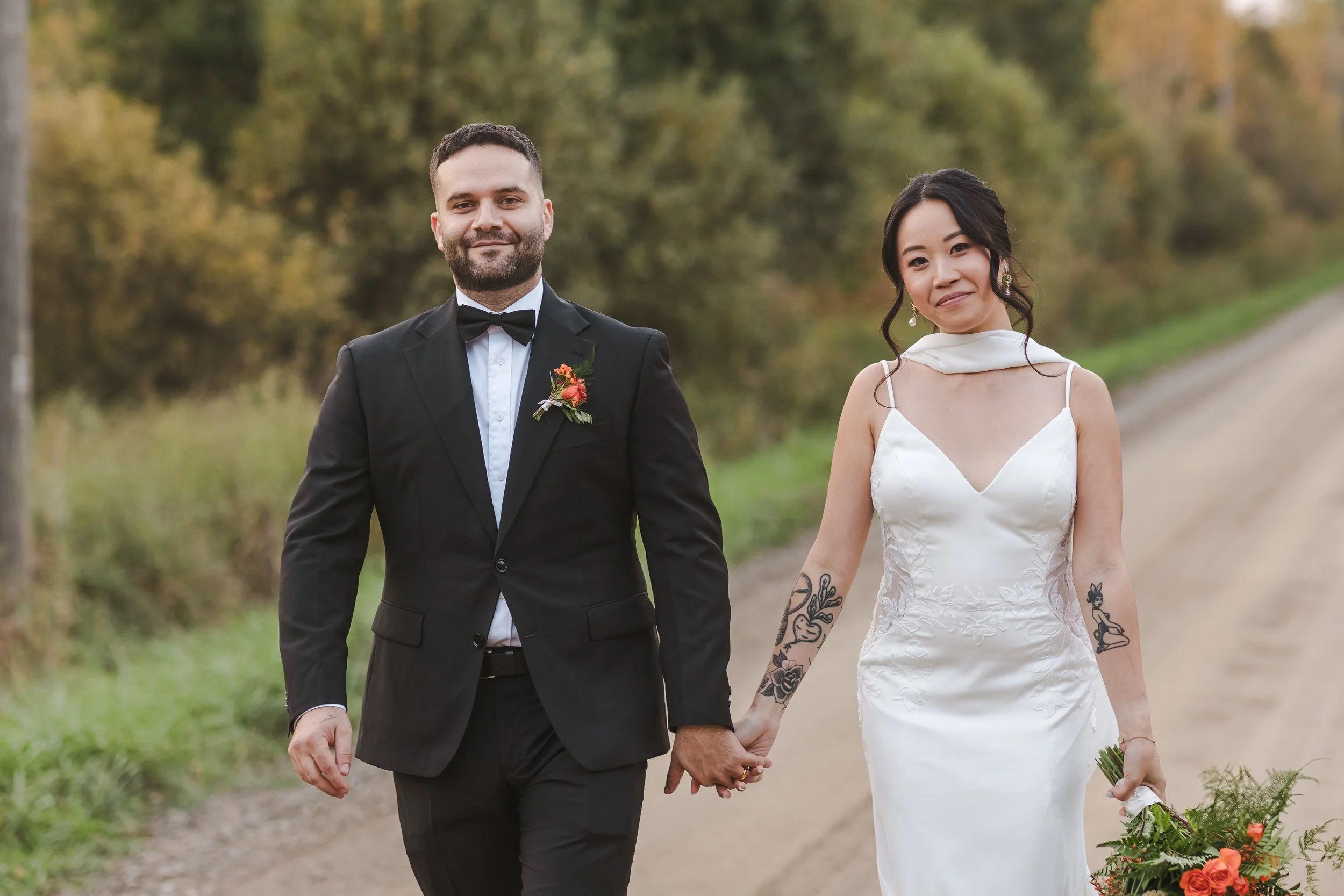 bride-and-groom-walking-down-dirt-path-fedora-media.jpg