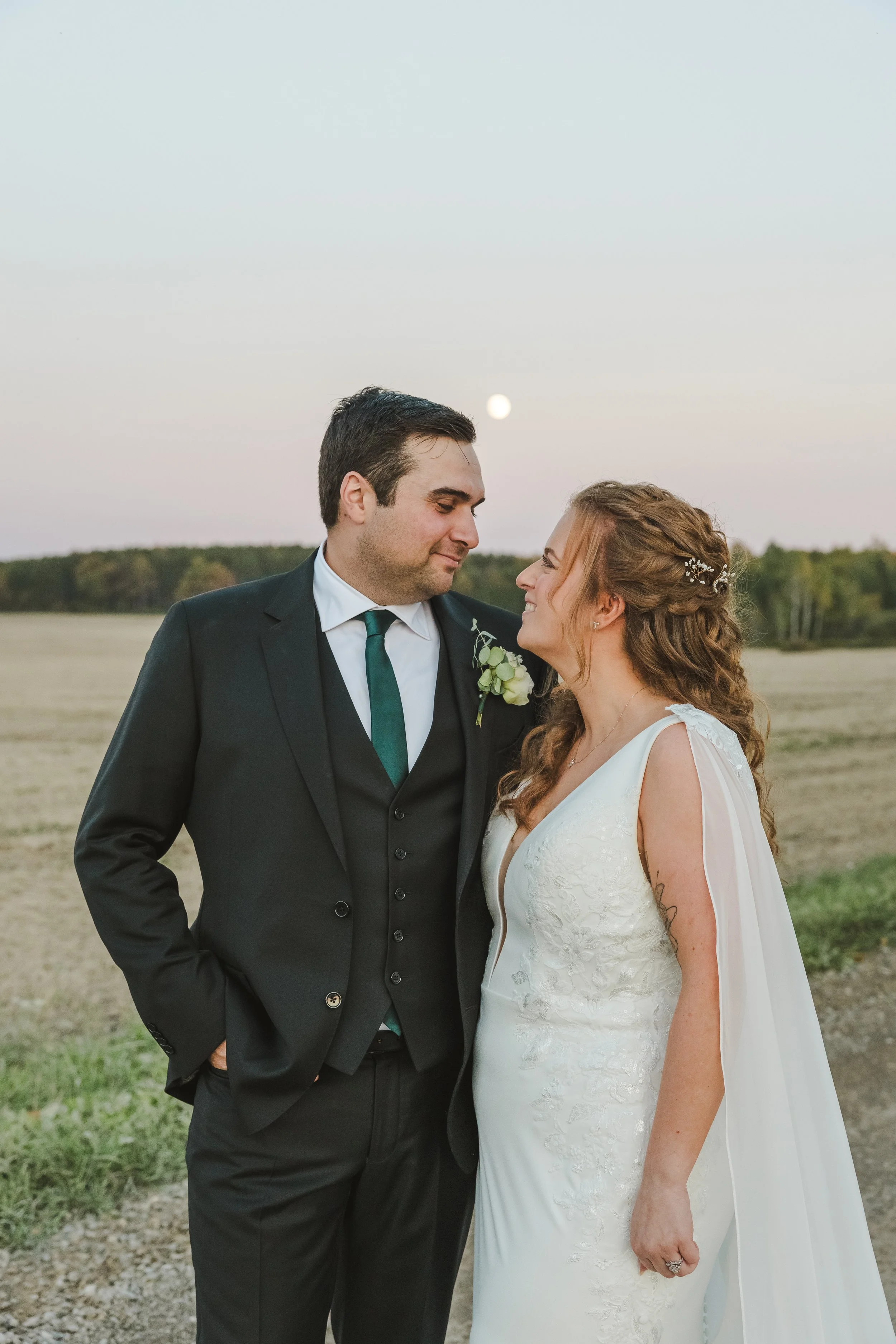 bride-and-groom-outside-with-sunset-fedora-media.jpg