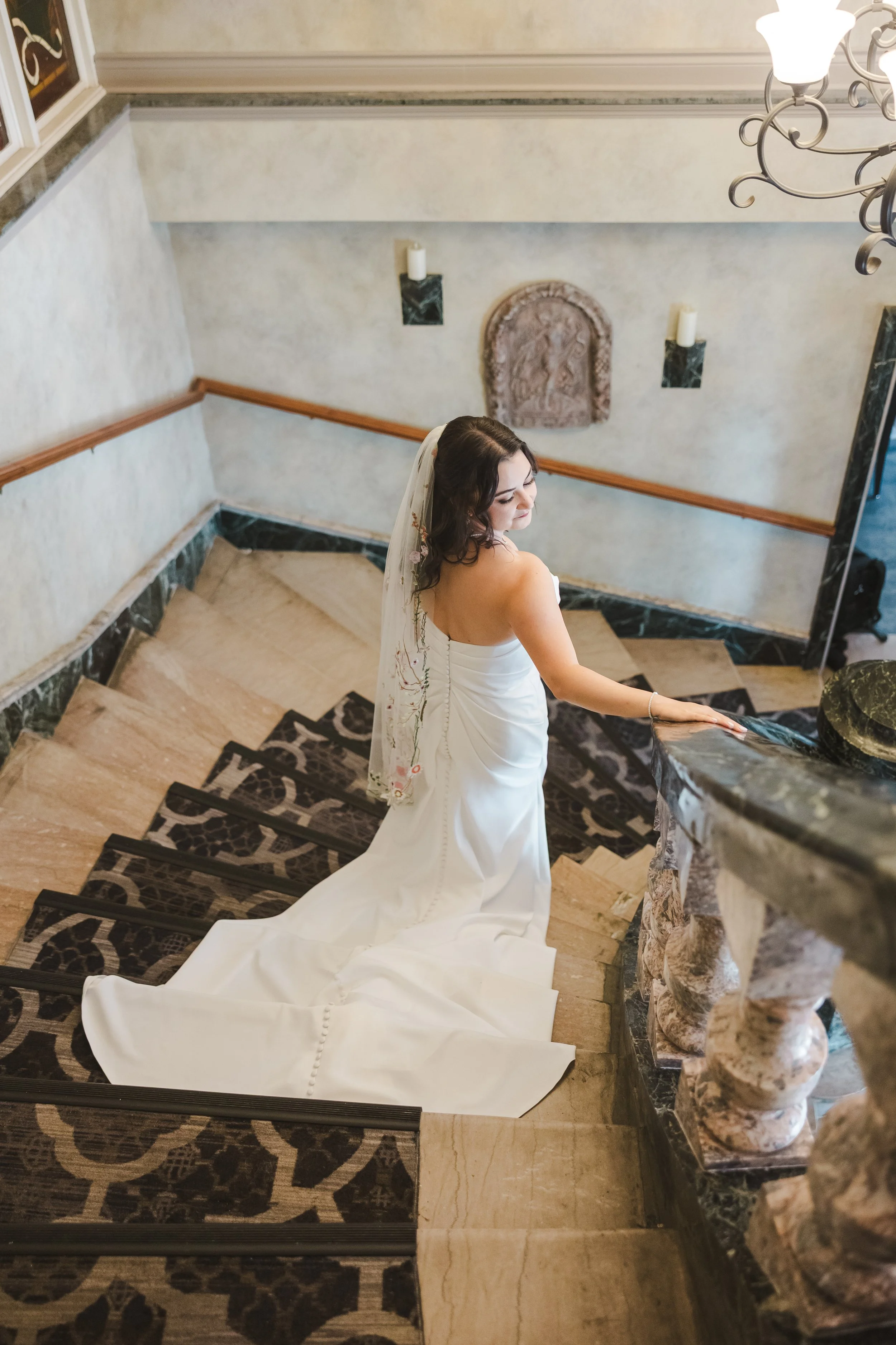bride-walking-down-stairs-fedora-media.jpg