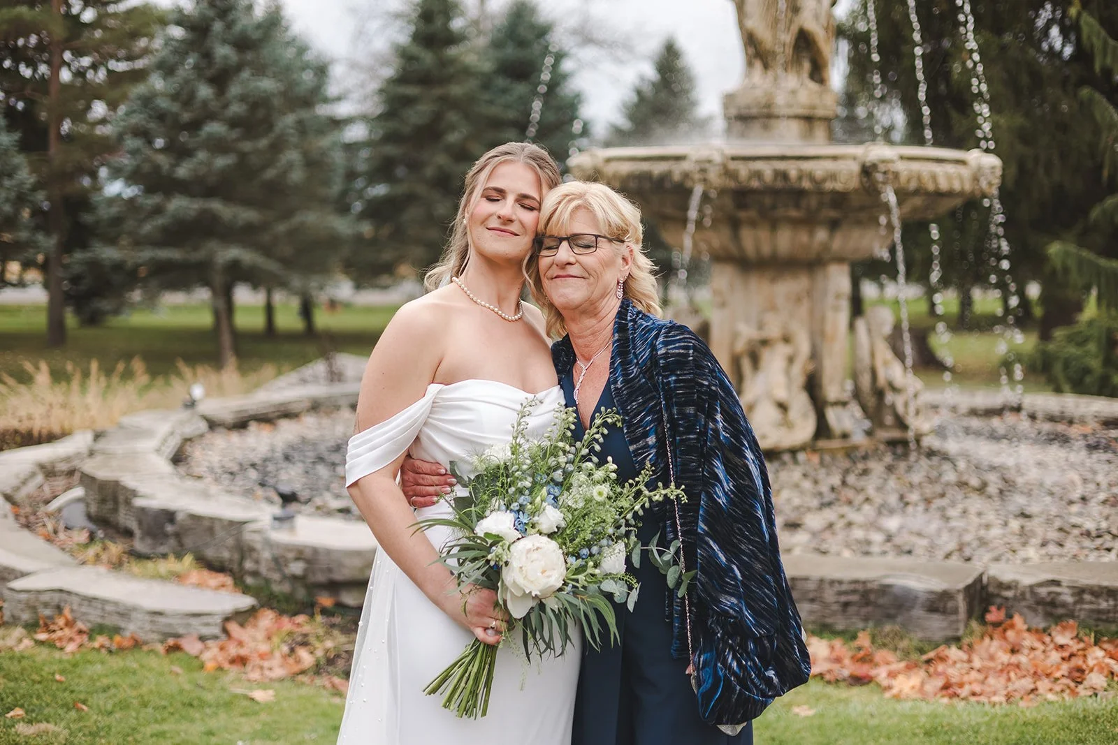 Bride hugging mom on wedding day  fall wedding  Fedora Media.jpg