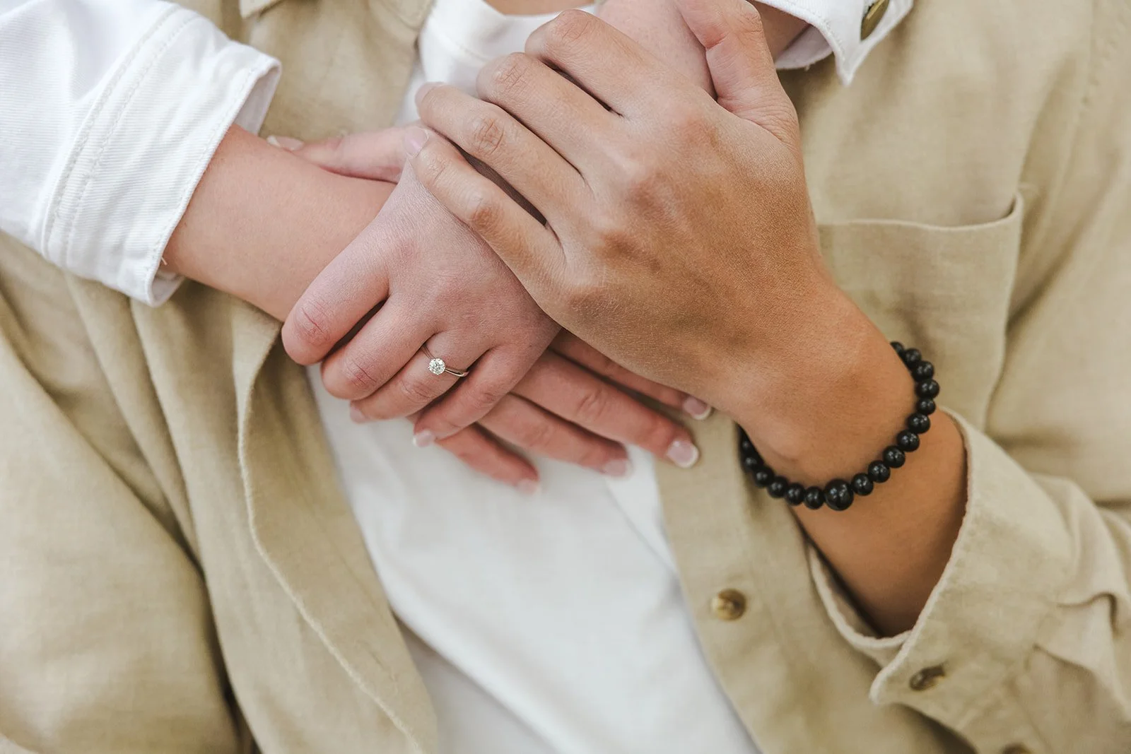 Embracing hands with engagement ring  Ontario Engagement  Fedora Media.jpg