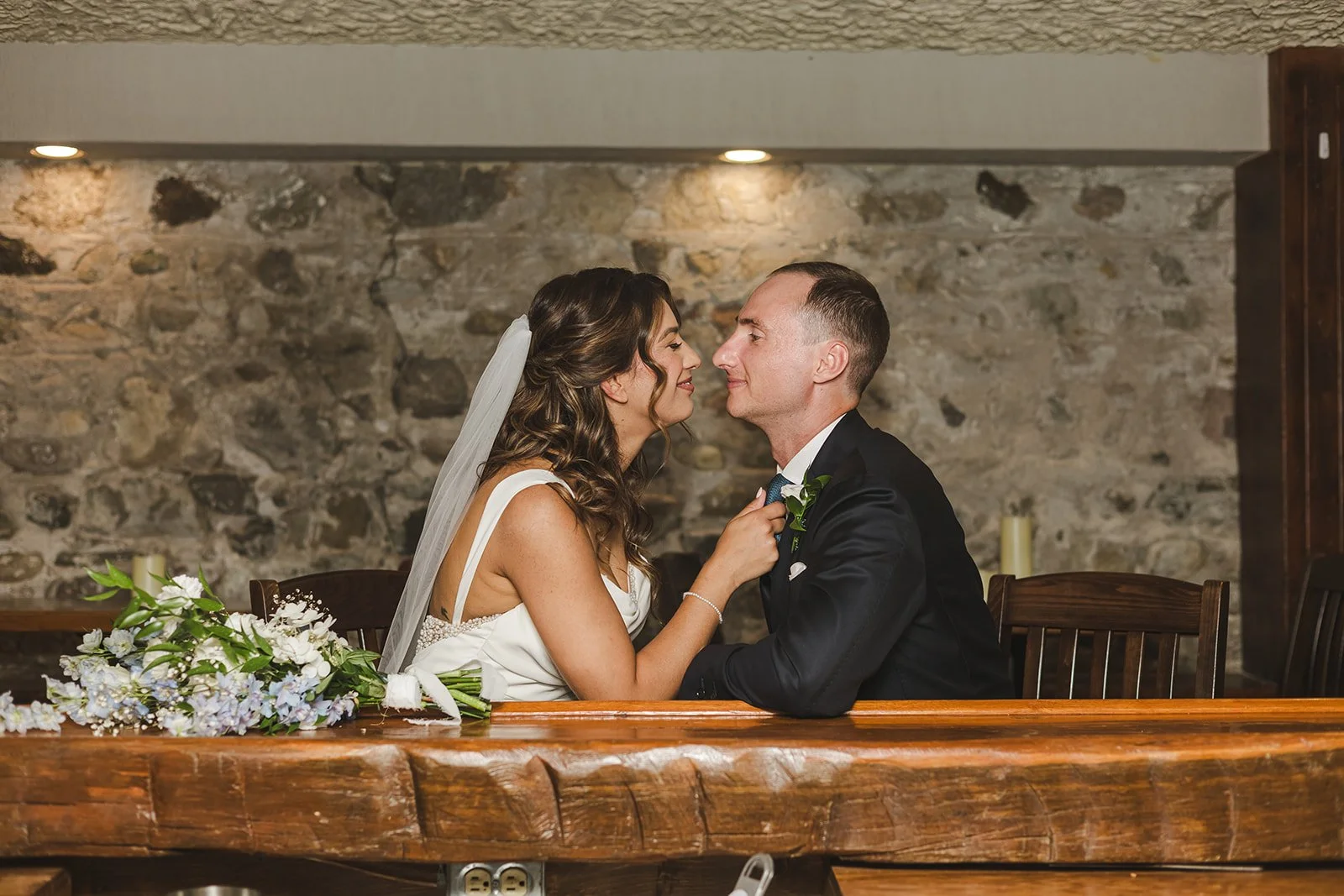 Bride pulls groom in at bar top  River's Edge  Arlington Hotel  Paris, ON  Fedora Media.jpg