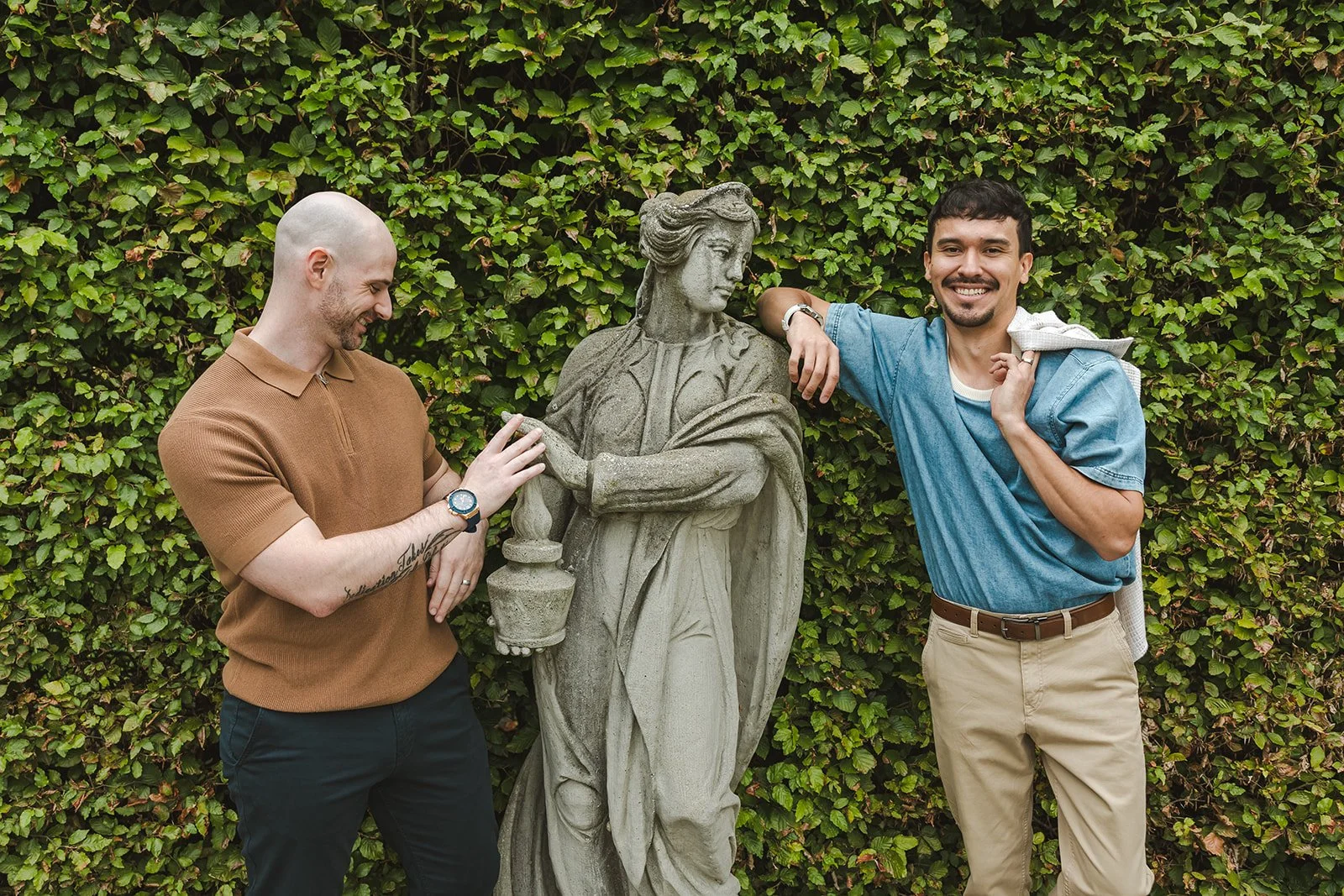 Couple smiling with statue  Ontario Engagement  Fedora Media.jpg