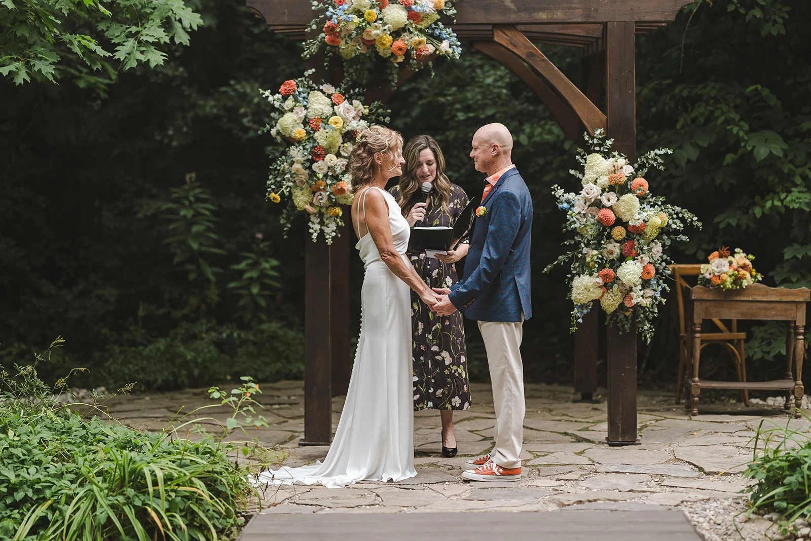 Bride and groom with officiant at altar  Erin Estates  Fedora Media.jpg
