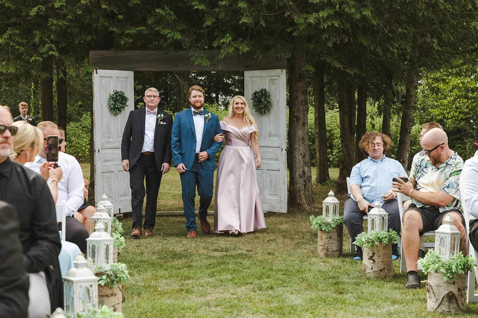 Groom walking down aisle with parents  CJ Country events  Guelph, ON  Fedora Media.jpg