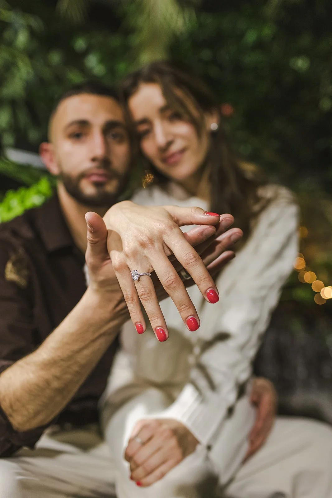Couple showing off hand with engagement ring  Proposal  Cambridge Butterfly Conservatory  Cambridge, ON  Fedora Media.jpg