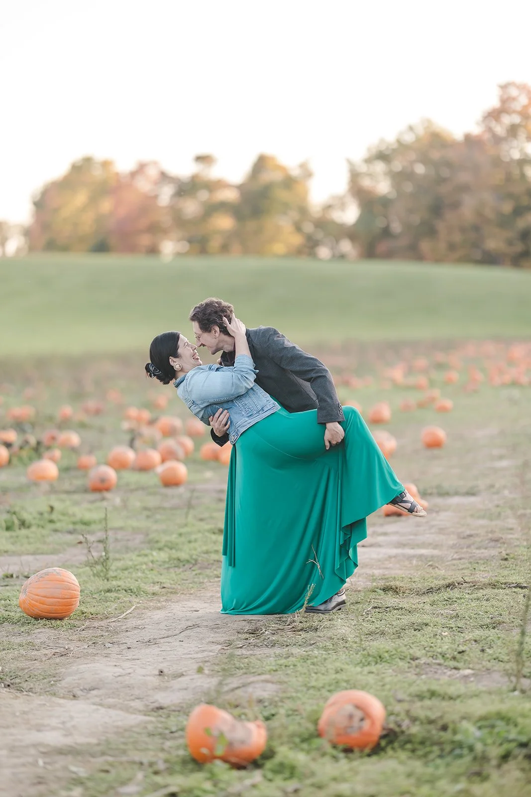 Couple dipping in pumpkin patch  Ontario Engagement  Fedora Media.jpg