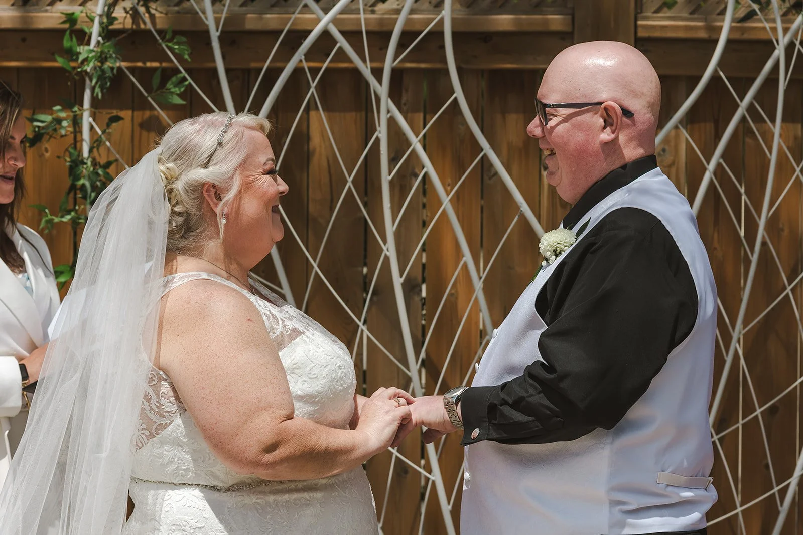 Bride and Groom exchange rings during wedding ceremony  Cambridge Hotel  Cambridge, ON  Fedora Media.jpg