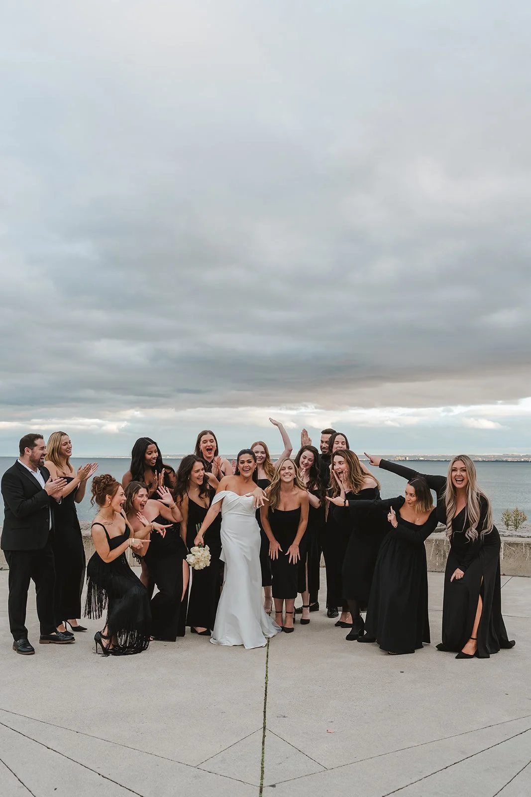 Bride shows off wedding ring with wedding party  Spencers at the waterfront  Pearle weddings  Burlington, ON  Fedora Media.jpg