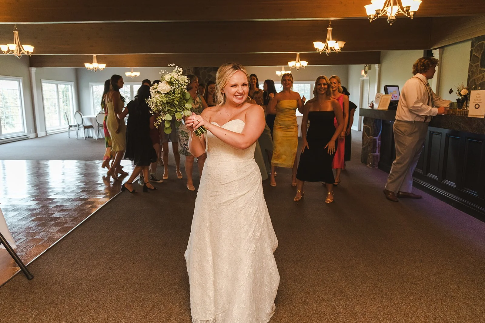 Bride smiling bouquet toss  Dundee Golf & Country Club  Fedora Media.jpg