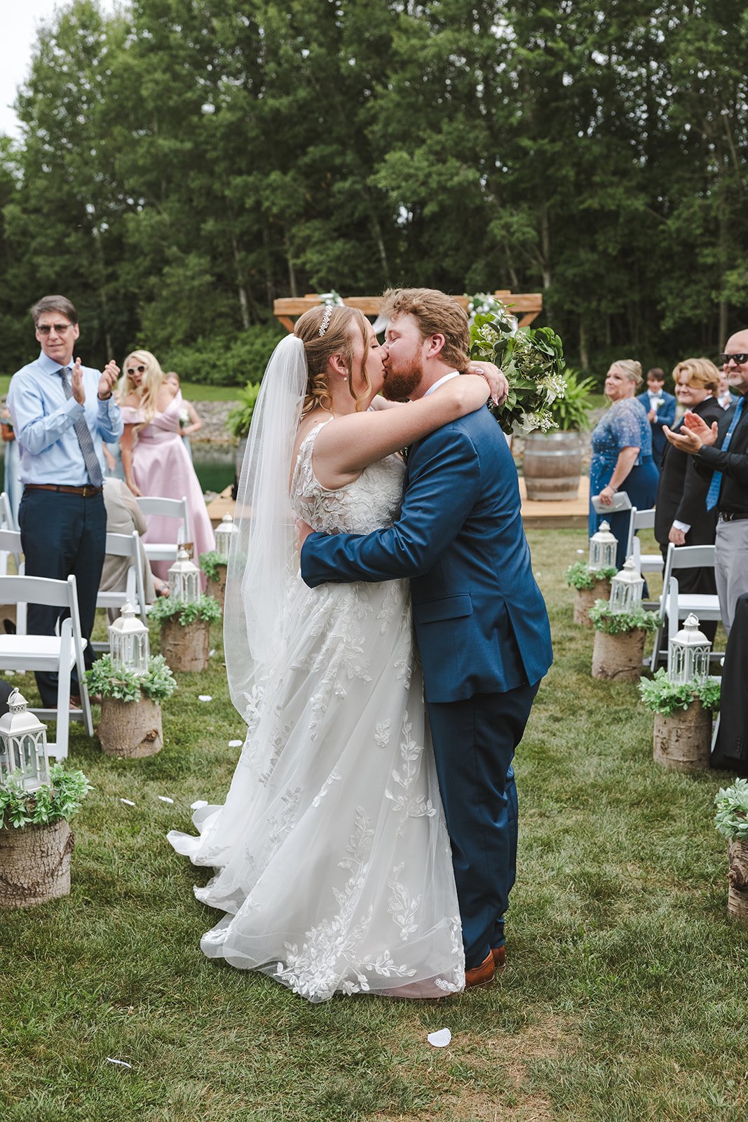 Bride and groom kiss in aisle  CJ Country events  Guelph, ON  Fedora Media.jpg