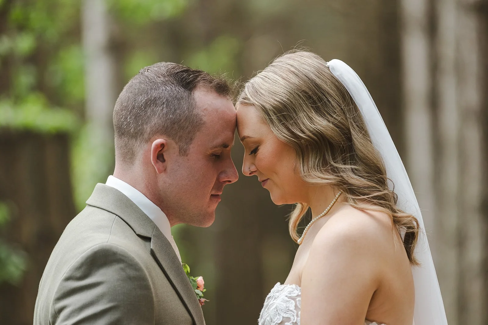 Bride and groom forehead to forehead  Erin Estates  Fedora Media.jpg