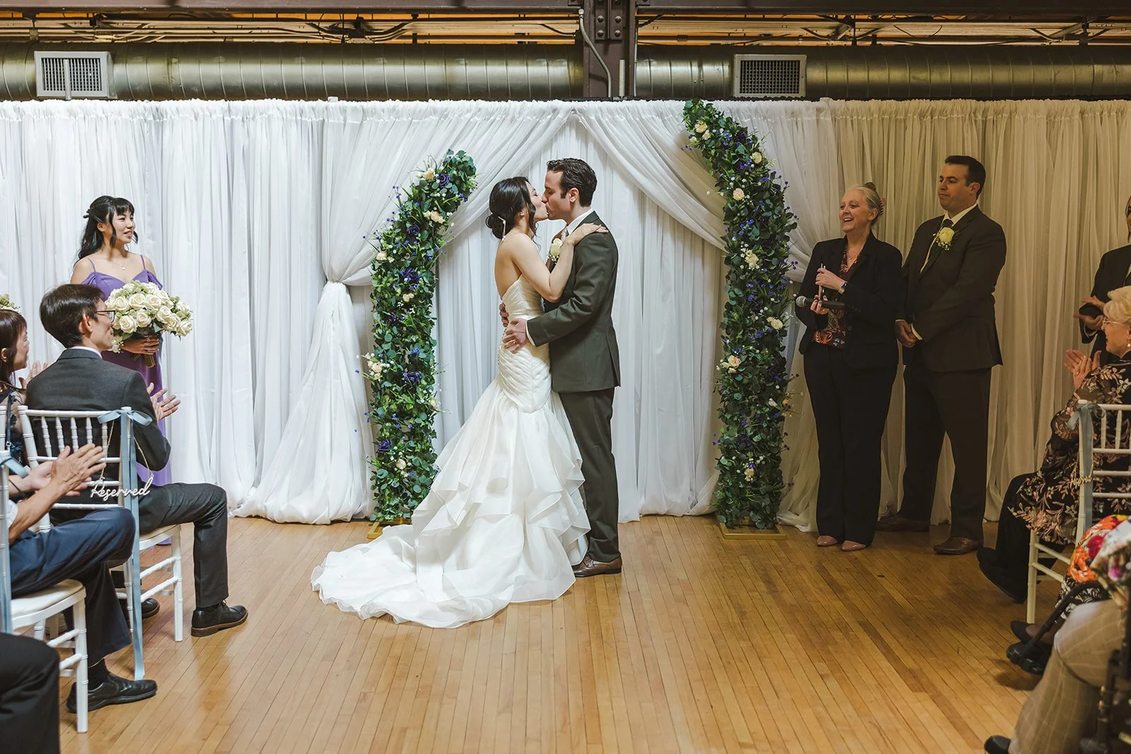 Bride and Groom share first kiss during wedding ceremony  Kitchener, ON  THE museum  Fedora Media.jpg