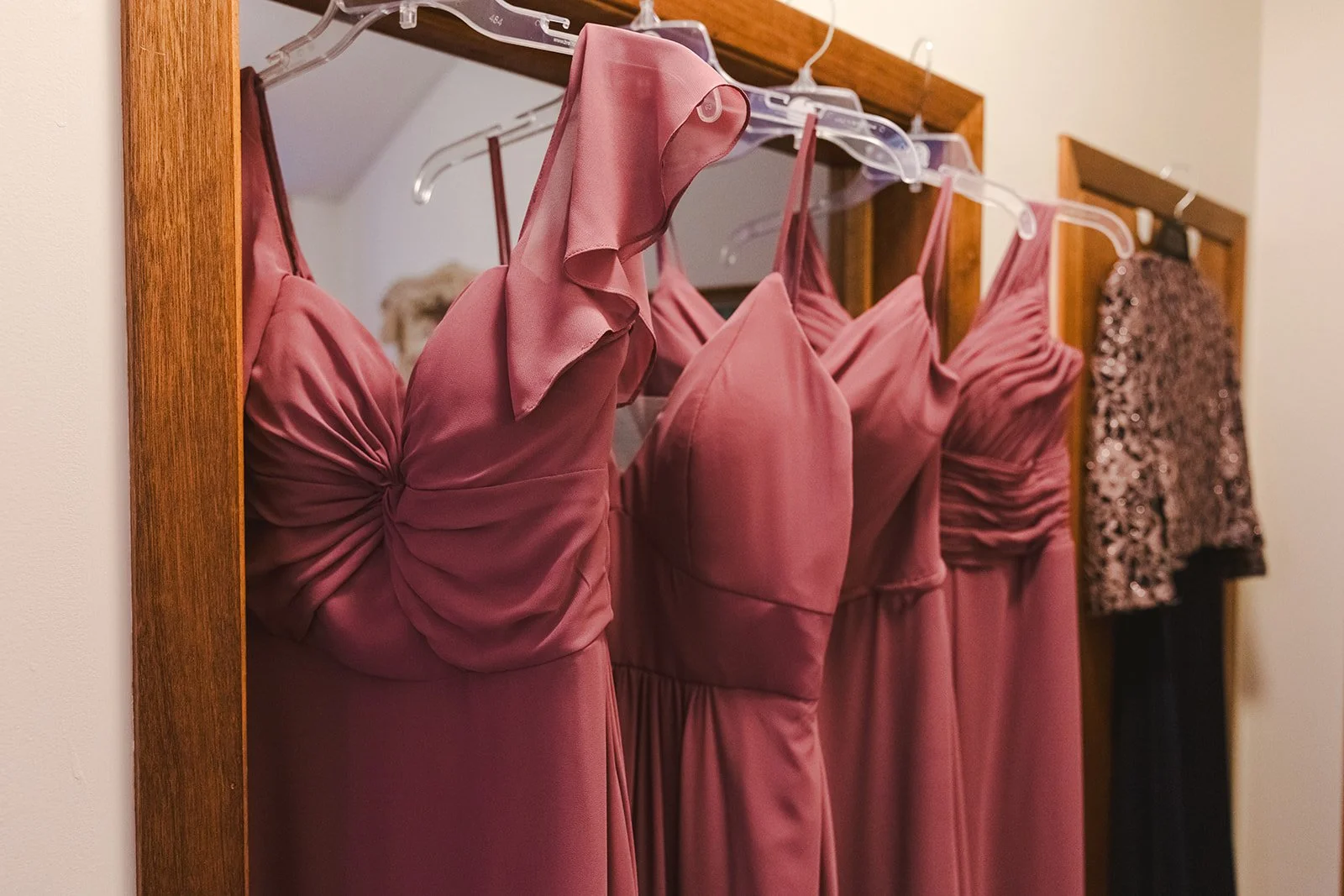 Bridemaids dresses hanging in doorway  Boho Wedding  Fedora Media.jpg
