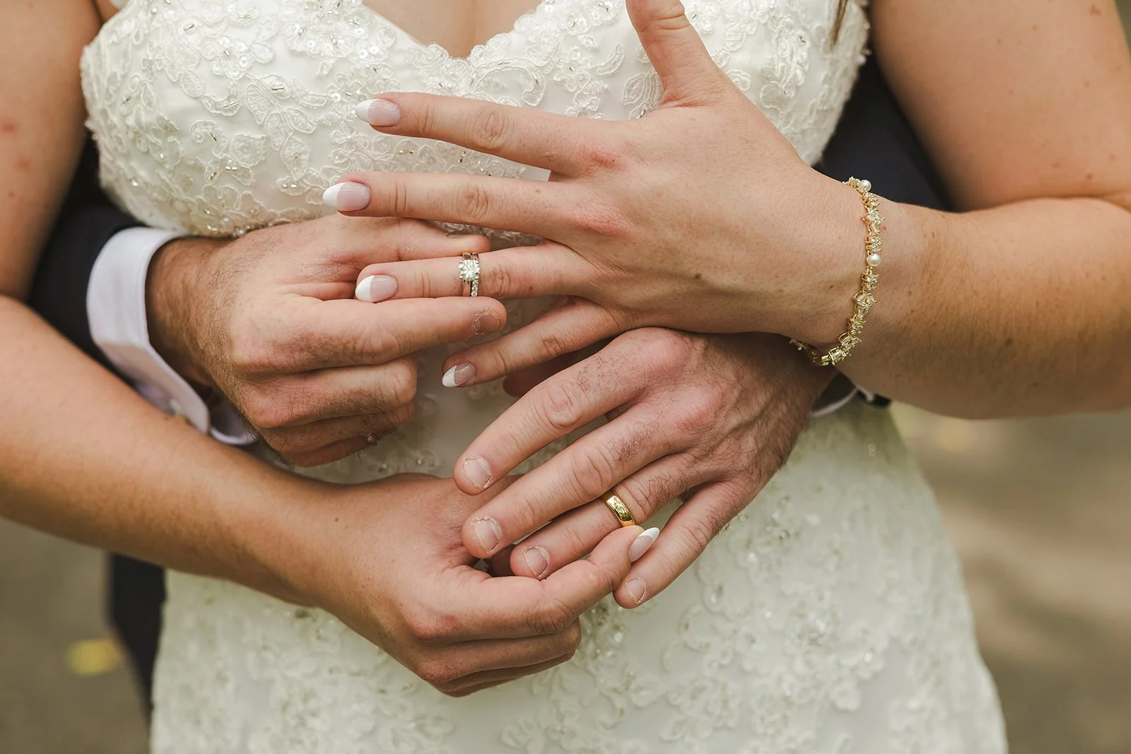 Bride and groom exchanging wedding rings  Carmen's Hotel  Hamilton, ON  Fedora Media.jpg