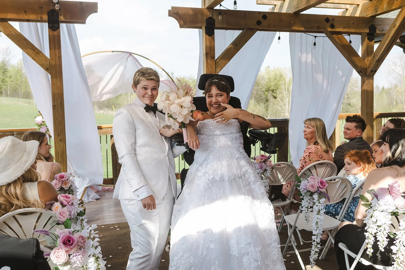 Brides showing off rings and celebrating  Pine Valley Chalet  Kitchener, ON  Fedora Media.jpg