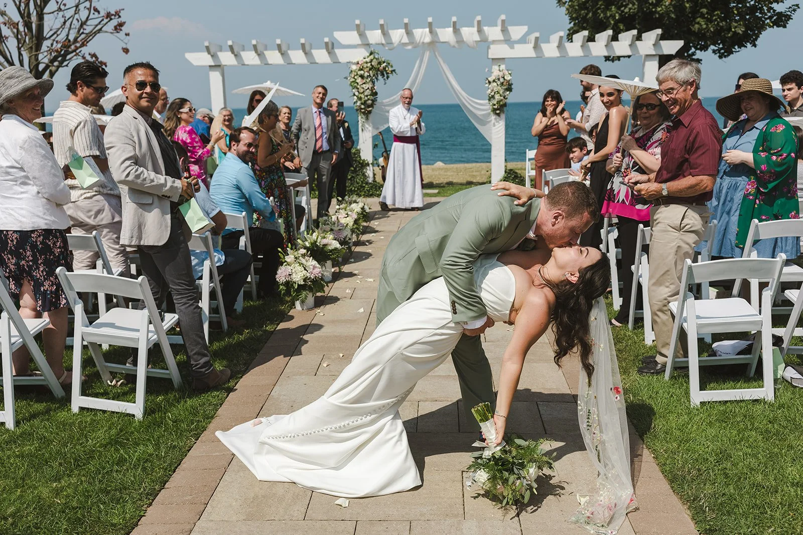 Bride and Groom dip kiss in aisle  Hamilton, ON  Fedora Media.jpg