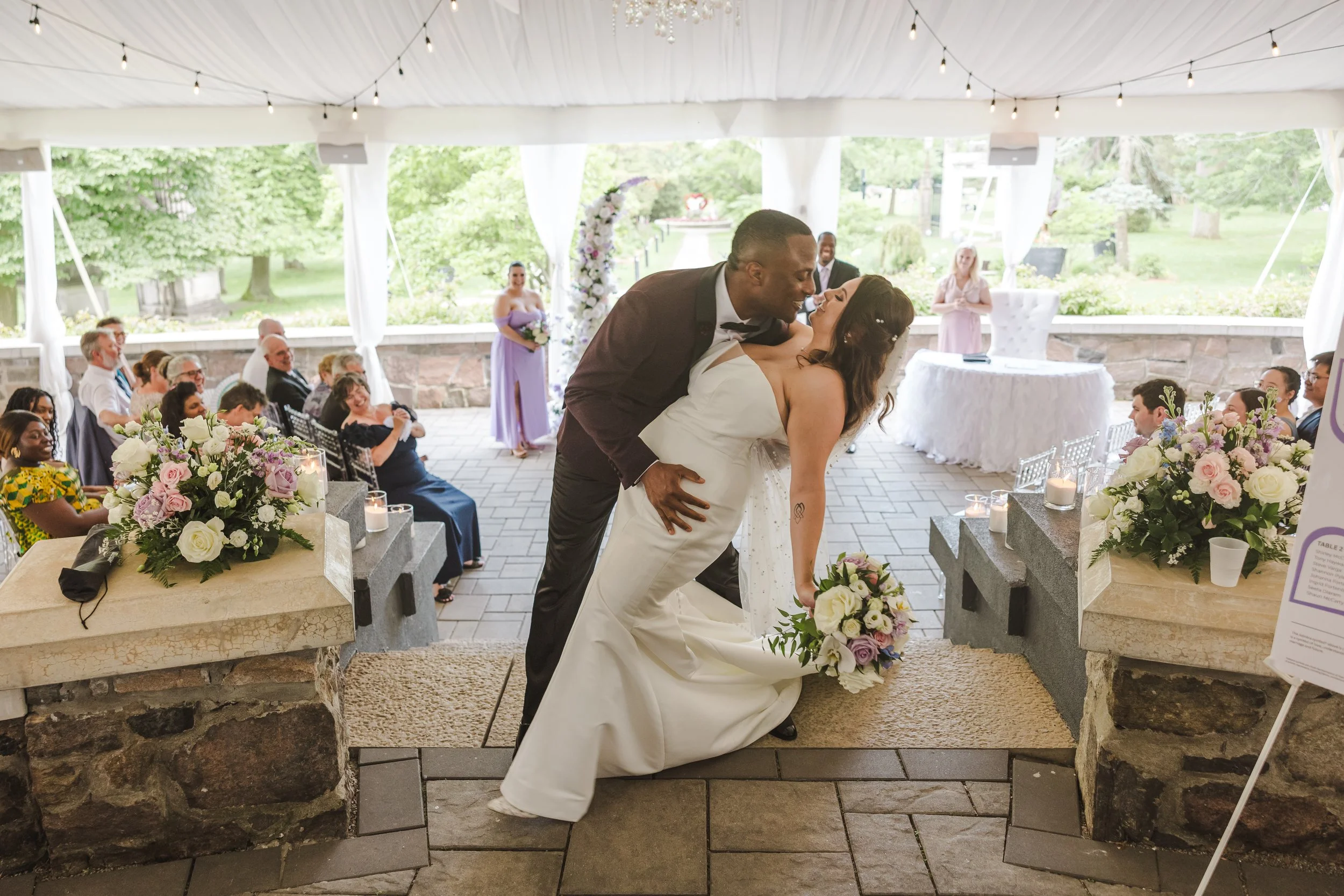 groom-holds-bride-fedora-media.jpg
