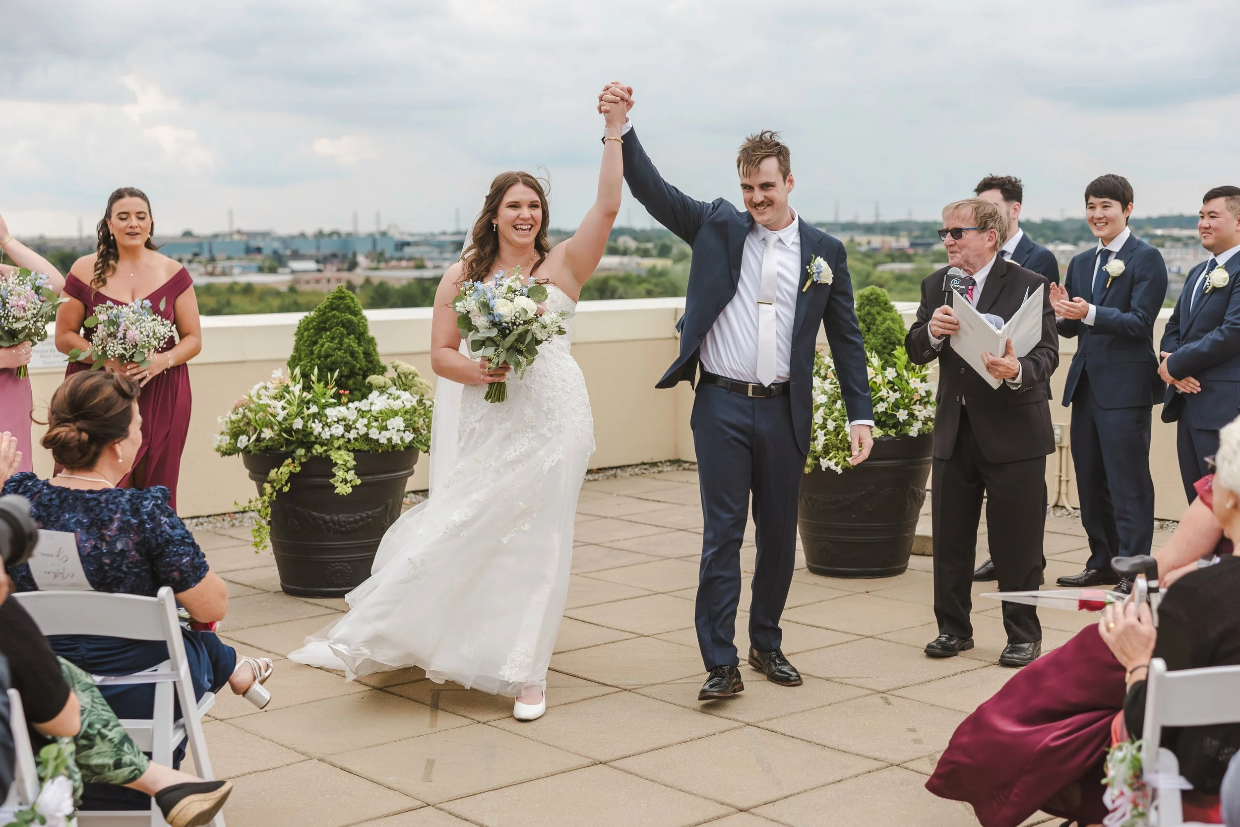 married-couple-walking-down-aisle-fedora-media.jpg