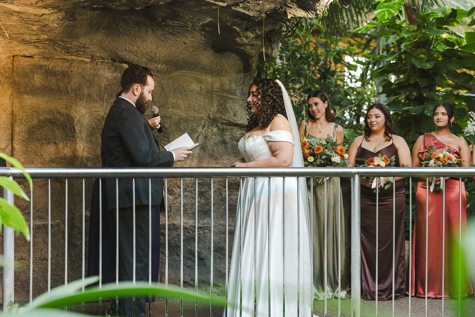 Groom reading vows during wedding ceremony  Cambridge Butterfly Conservatory  Cambridge, ON  Fedora Media.jpg
