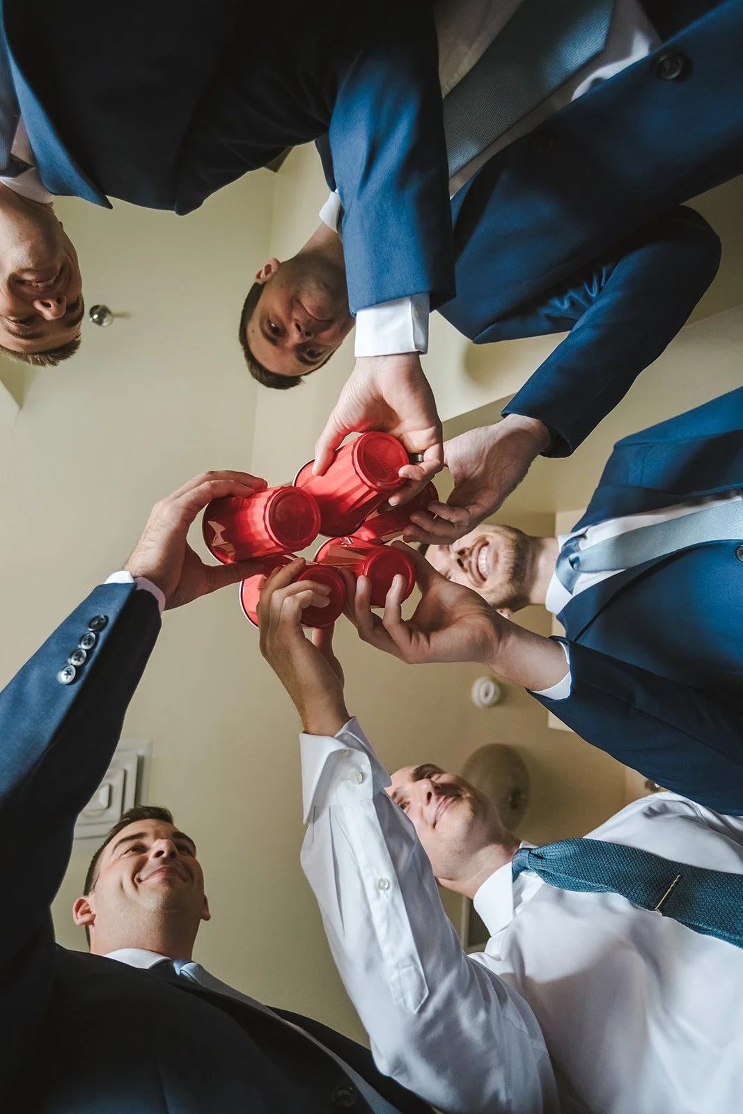 Groomsmen cheersing drinks  River's Edge  Arlington Hotel  Paris, ON  Fedora Media.jpg