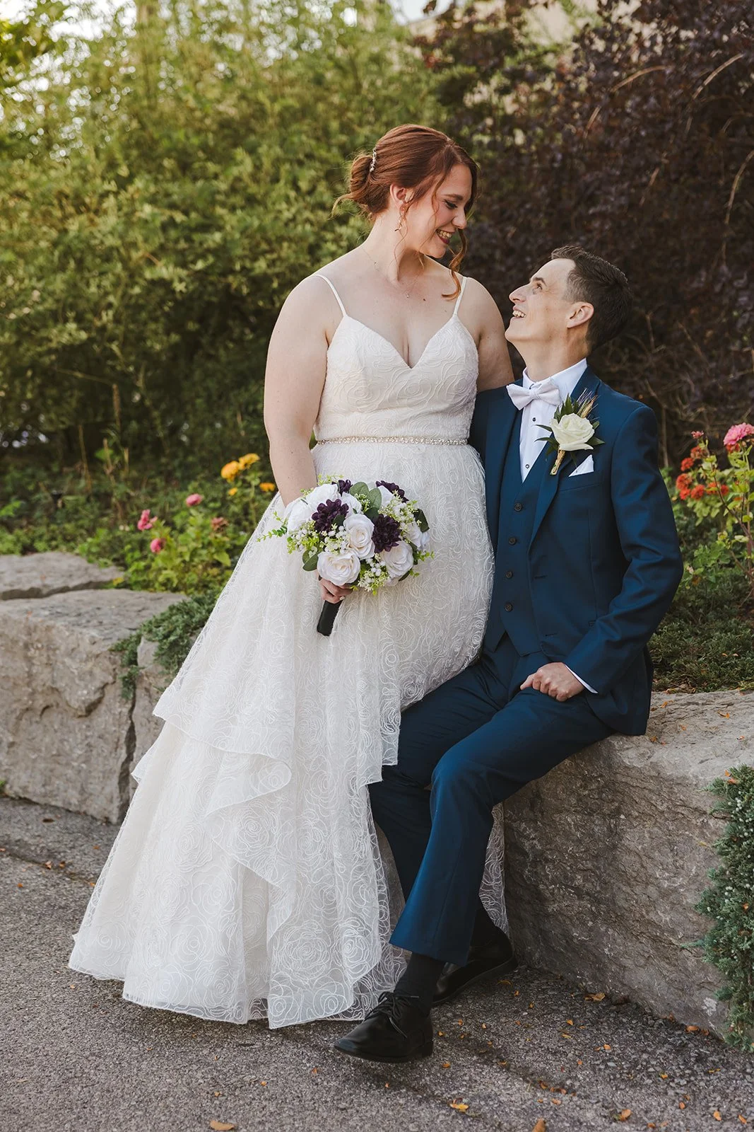 Bride sitting on grooms lap  Golf Course Wedding  Fedora Media.jpg