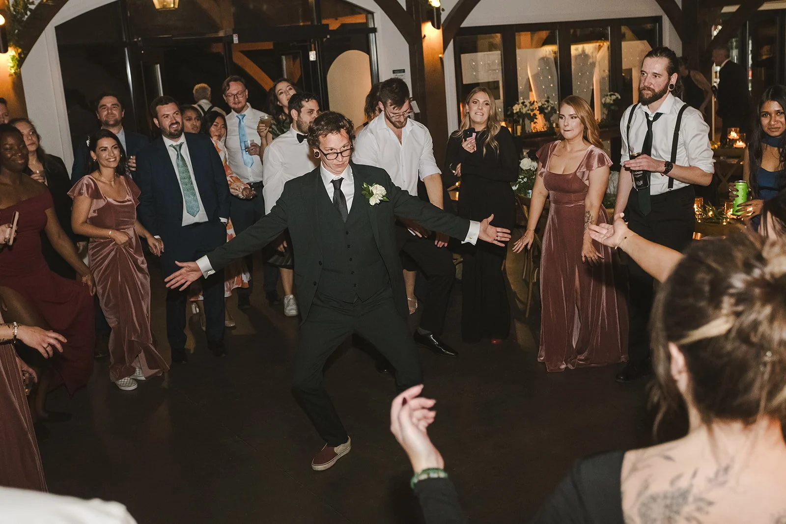 Groom on dance floor with guests  Erin Estates  Fedora Media.jpg