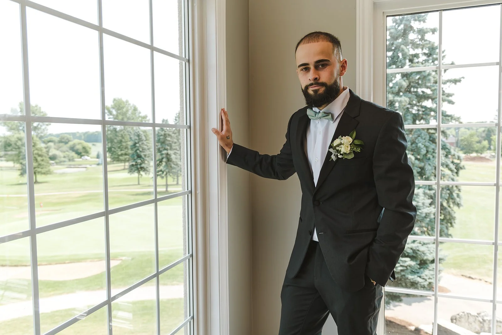Groom leaning in window  Dundee Golf & Country Club  Fedora Media.jpg