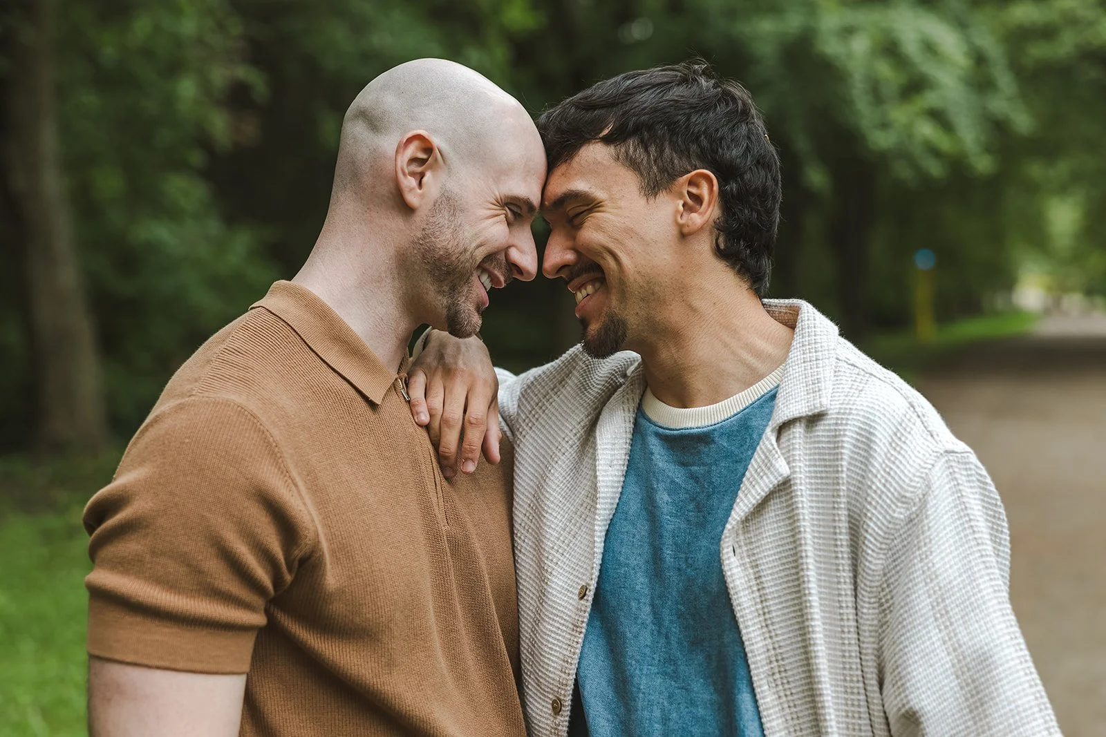 Couple smiling while touching foreheads  Ontario Engagement  Fedora Media.jpg