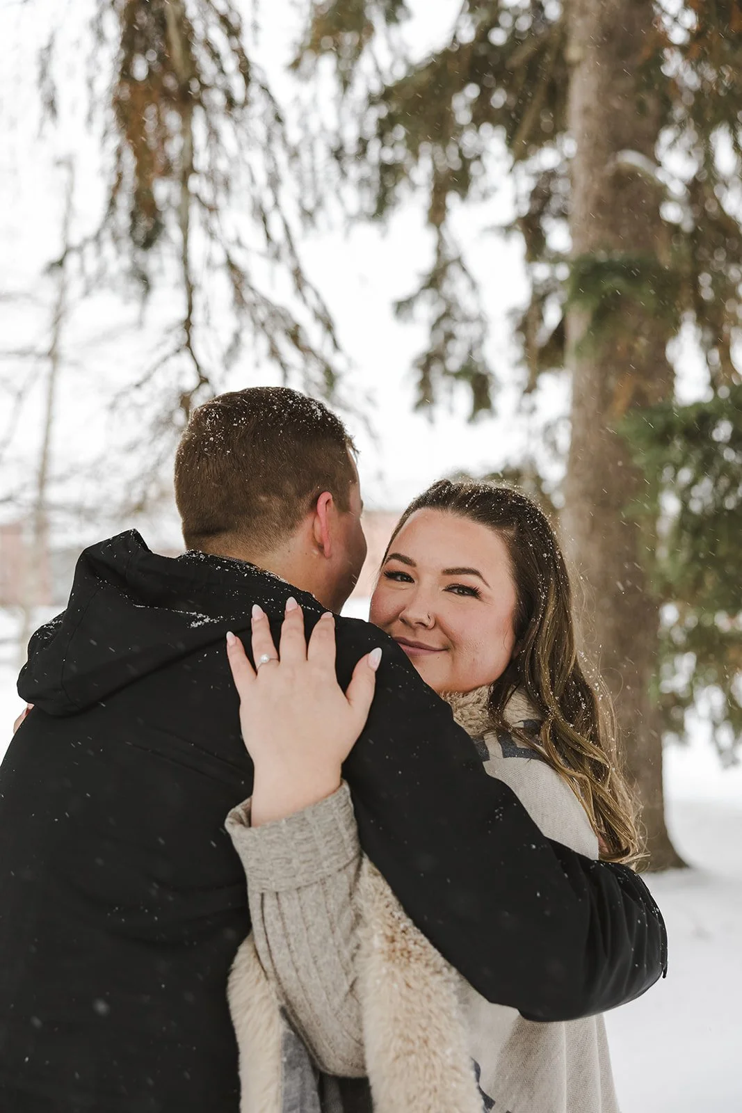 Couple embraces with woman smiling  Ontario Engagement  Fedora Media.jpg