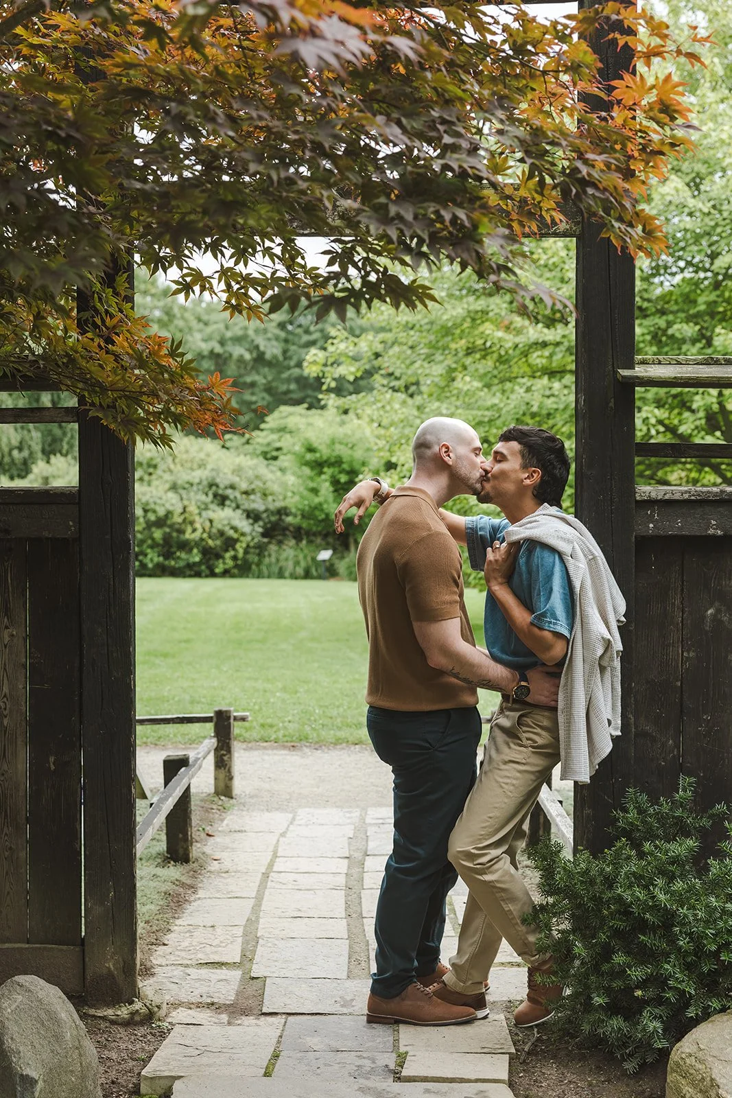 Couple kissing with jacket over shoulder  Ontario Engagement  Fedora Media.jpg