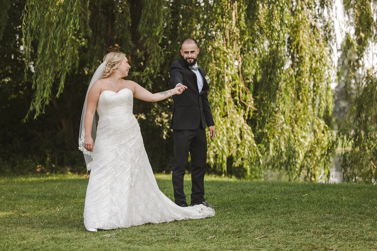 Bride and groom dance in front of willow tree Dundee Golf & Country Club  Fedora Media.jpg