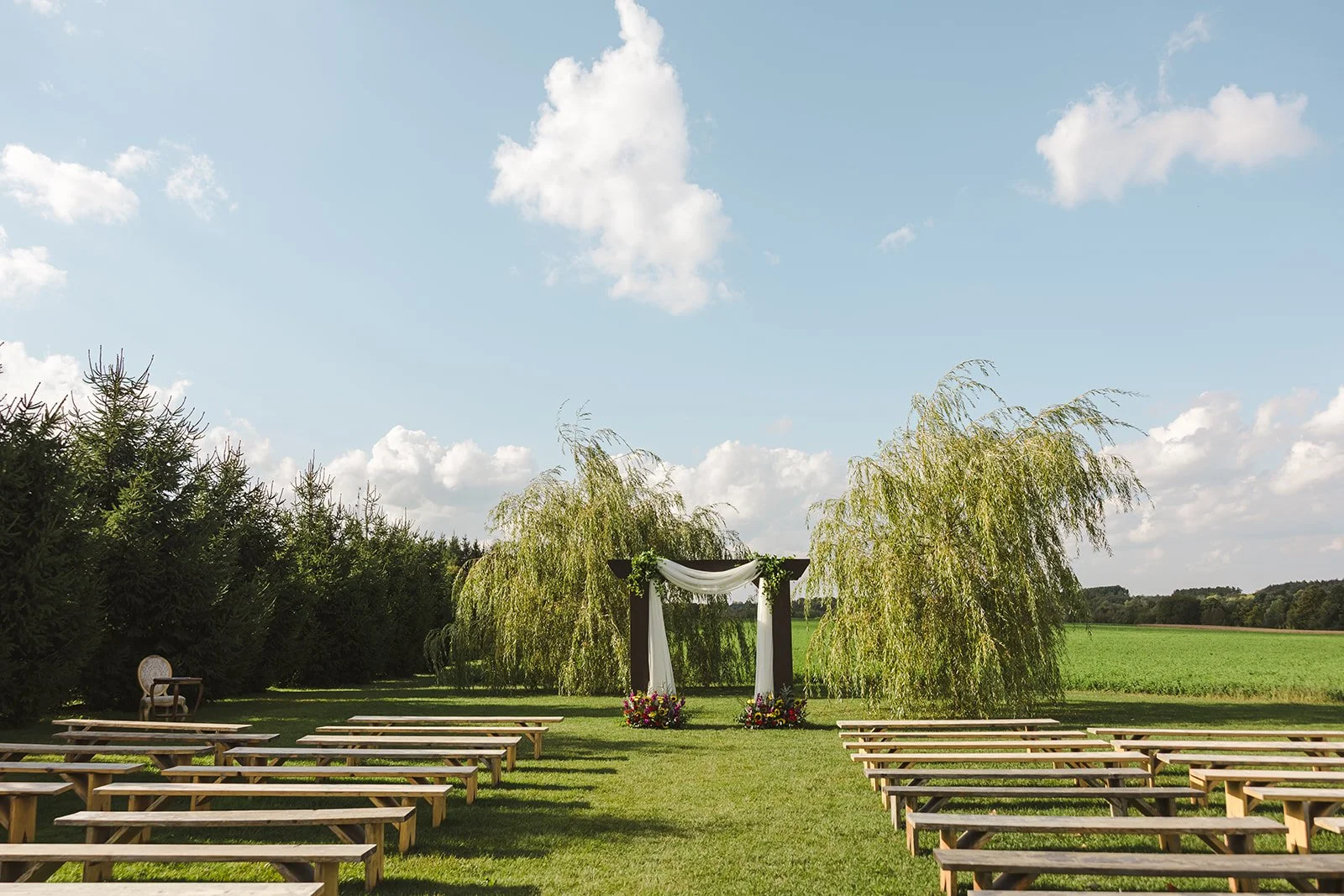 Rustic wedding ceremony  Barn Swallows at Thatcher Farm  Fedora Media.jpg