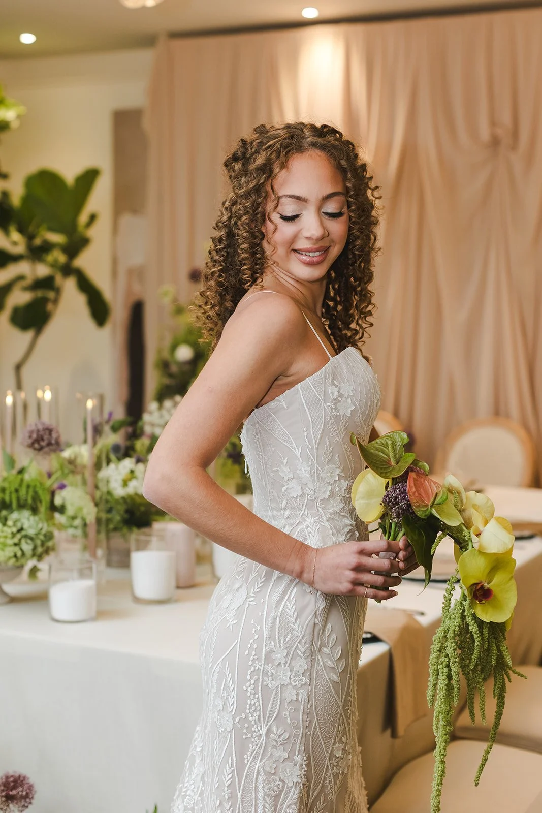 Bride looking down while holding bouquet  Urban Jungle  Black Shop Restaurant  Cambridge, ON  Fedora Media.jpg