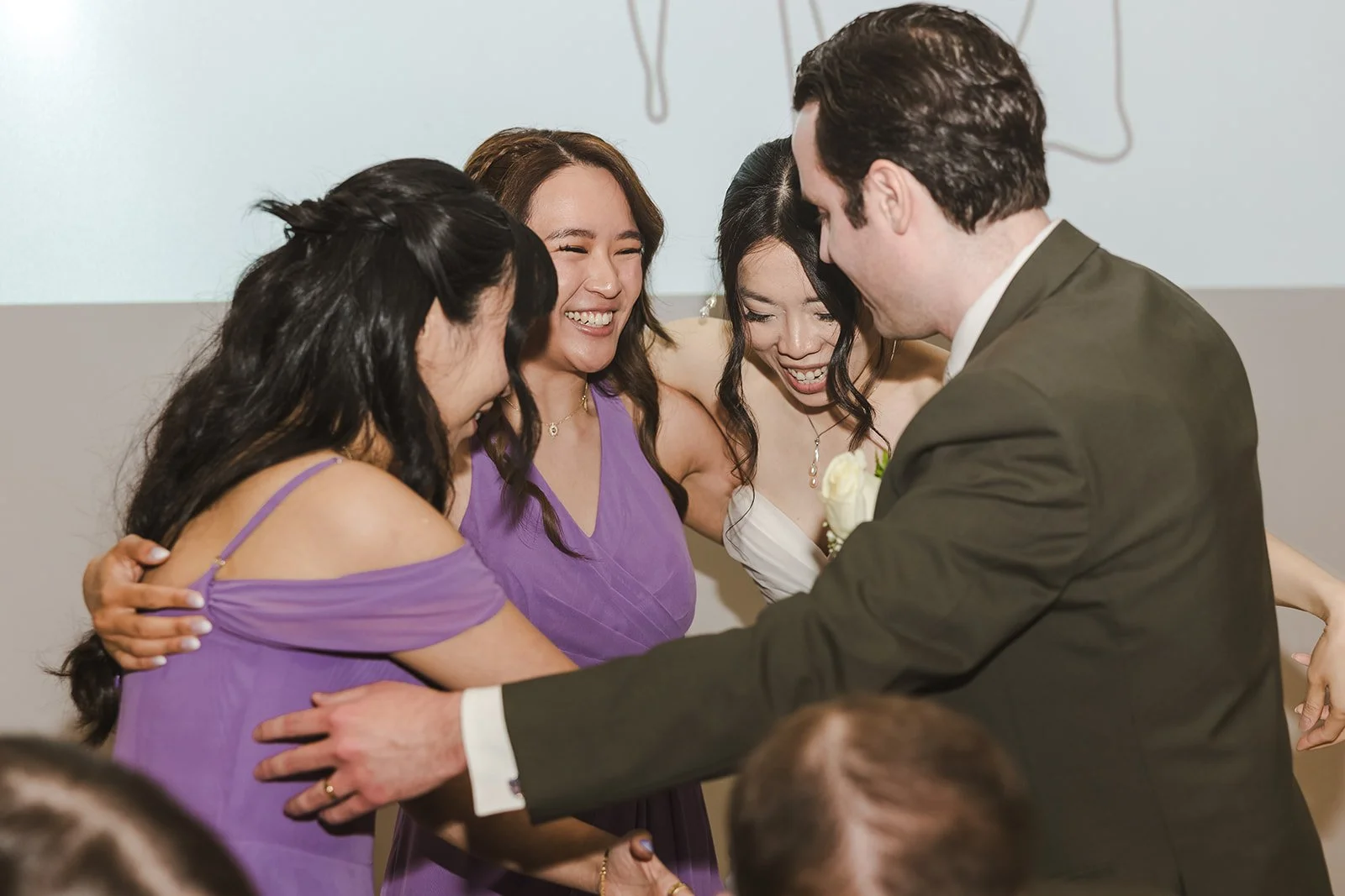 Bride and Groom huddle with bridemaids  Kitchener, ON  THE museum  Fedora Media.jpg